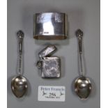 Silver napkin ring with Sheffield hallmarks, a pair of spiral stemmed silver coffee spoons, and a