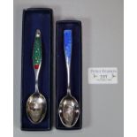 Two silver and enamel Christmas spoons, 'Christmas 1928 the fir tree' and 'Christmas 1976 Angus