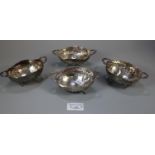 Set of four 19th century silver two handled sweet meat dishes/bowls on out swept feet with