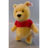 Modern Steiff Mini Winnie the Pooh blond teddy bear in original box. (B.P. 21% + VAT)