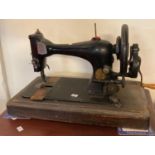Wooden cased Singer sewing machine. (B.P. 21% + VAT)