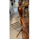 Novelty modern hardwood study of a parrot perched on a pedestal tripod base with hanging chain and