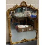 Modern gilt framed mirror, overall with floral and foliate scroll decoration. (B.P. 21% + VAT)