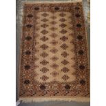 Small beige ground middle eastern design runner, having central lozenge geometric decoration and