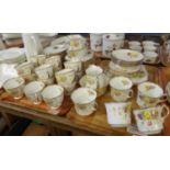 Two trays of Royal Standard English bone china floral and gilt teaware to include: teacups and