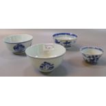 A group of four Chinese porcelain blue and white bowls comprising three small rice bowls dating to