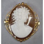 9ct gold scroll work framed carved cameo brooch. (B.P. 21% + VAT)