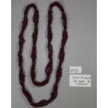 Garnet bead triple strand necklace. (B.P. 21% + VAT)