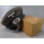 German WWII style officer's cap (lacking peak) together with a boxed respirator gas mask with