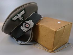 German WWII style officer's cap (lacking peak) together with a boxed respirator gas mask with