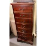 Modern hardwood bow front seven drawer chest of narrow form on bracket feet. (B.P. 21% + VAT)