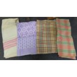 Box containing four vintage blankets or bedspreads; one cream blanket with pink stripe and '