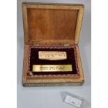 Modern bone inlaid hardwood box containing reproduction of a prehistoric text engraved on a