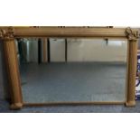 Regency style gilded wooden bevel plate over mantel mirror, having reeded columns and foliate and