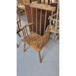 Primitive design stickback armchair on three legs. (B.P. 21% + VAT)