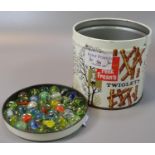 Cylindrical tin containing a large selection of glass multi coloured marbles. (B.P. 21% + VAT)