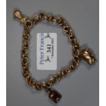 Unmarked yellow metal charm bracelet with animal and lantern charms. 13.5g approx. (B.P. 21% + VAT)