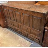 18th century oak coffer/mule chest, the hinged lid above an arrangement of nine fielded panels above