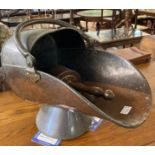 Copper helmet shaped coal scuttle with two shovels. (B.P. 21% + VAT)