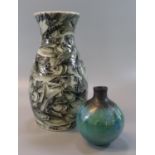 Modern Art pottery vase of mallet shaped form, overall with a shoal of fish. 24cm high approx.
