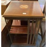 Edwardian mahogany inlaid revolving book case on quadraform base with cups and casters. (B.P.