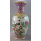 20th century Chinese porcelain polychrome decorated baluster shaped vase, decorated in famille-