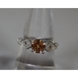 Padparadscha and white topaz silver dress ring. 3.5g approx. Ring size O. (B.P. 21% + VAT)