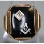 9ct gold Masonic signet ring, set with black stone having single small diamond. 5.2g approx. Ring