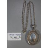 Silver Victorian style oval hinged locket and chain. (B.P. 21% + VAT)