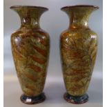Pair of late 19th/early 20th Century Doulton Lambeth stoneware vases overall decorated with Autumn