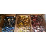 Three boxes of playworn mainly diecast model tractors, in various colourways, to include: Massey