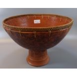 Terracotta stemmed bowl with a basket weave to the rim, probably African origin. 30.5cm wide, 23cm