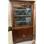 19th century oak two stage astragal glazed single door corner cupboard, the moulded cornice above