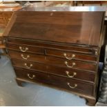 19th century mahogany fall front bureau above an arrangement of two short and three long drawers