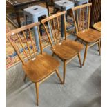 Set of three elm Ercol stick back kitchen chairs. (3) (B.P. 21% + VAT)