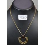 Gold plated archaic design pendant and chain. (B.P. 21% + VAT)