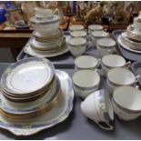 Two trays of Royal Albert 'Crown' china teaware, florally decorated, with a powder blue band and