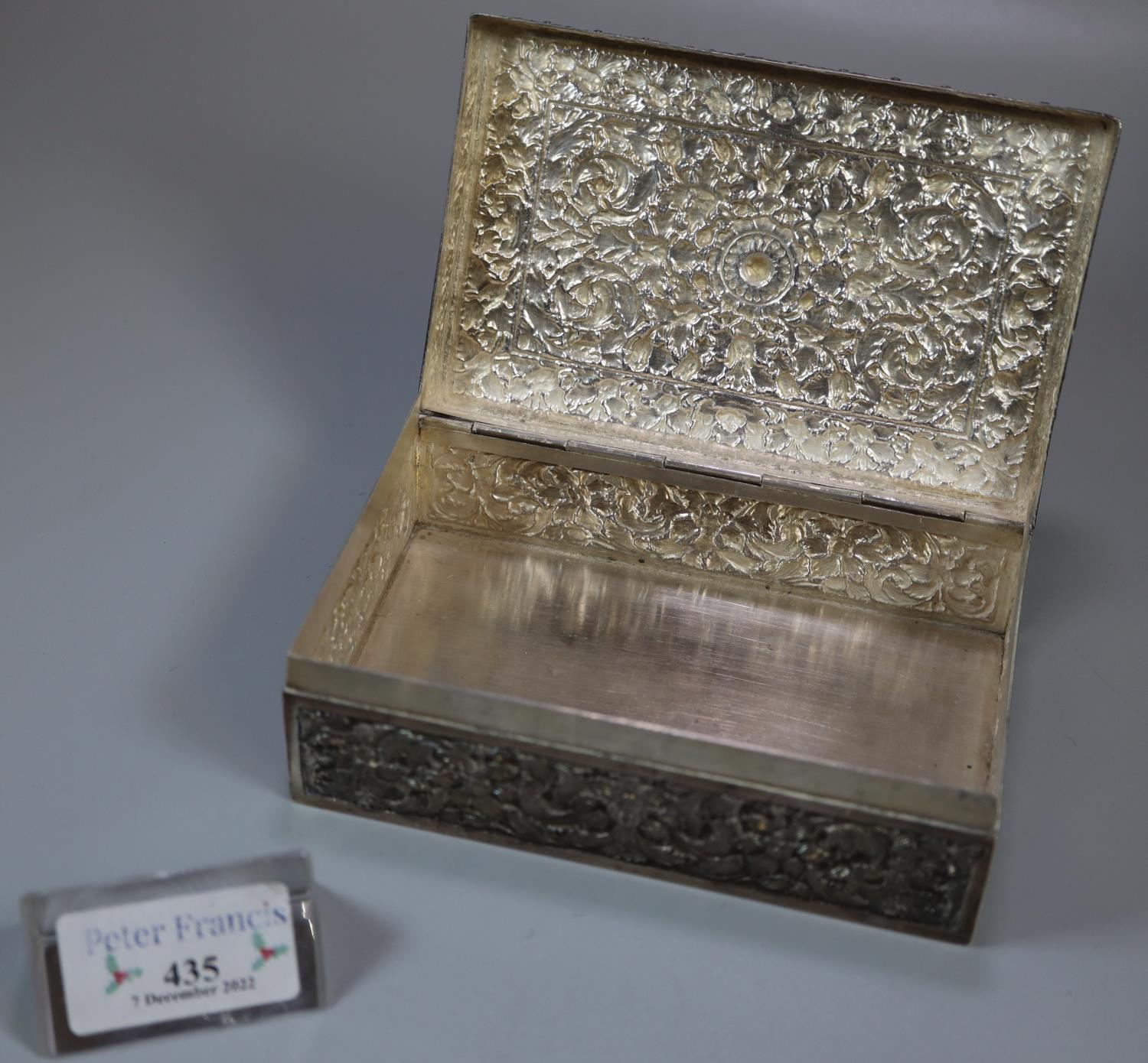 Indian silver rectangular shaped repousse decorated cigarette box with hinged cover. 9.4 troy ozs - Image 2 of 2