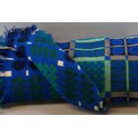 Vintage woollen Welsh tapestry traditional Caernarfon design blanket on blue ground with fringed