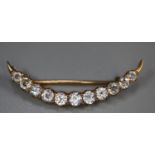 9ct gold clear stone set crescent brooch. 2g approx. (B.P. 21% + VAT)