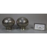 Pair of Indian silver foliate decorated globular lidded salts on pedestal bases. (2) 3.4 troy ozs
