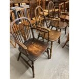 Pair of elm and beech hoop and stick wheel back armchairs, together with a similar armchair. (3) (