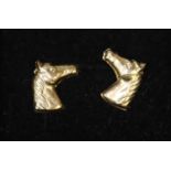 Pair of gold horses head stud earrings. (B.P. 21% + VAT)