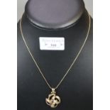 14ct gold fine link necklace with stylised 'C' scroll pendant. 6.2g approx. (B.P. 21% + VAT)