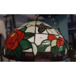 Tiffany style ceiling light shade, overall decorated with roses and foliage. (B.P. 21% + VAT)