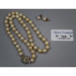 Cultured graduated pearl necklace with a pair of cultured pearl stud earrings. (B.P. 21% + VAT)