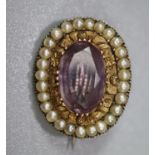 Victorian style purple stone and seed pearl oval shaped pin brooch. 4.8g approx. (B.P. 21% + VAT)