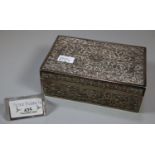 Indian silver rectangular shaped repousse decorated cigarette box with hinged cover. 9.4 troy ozs