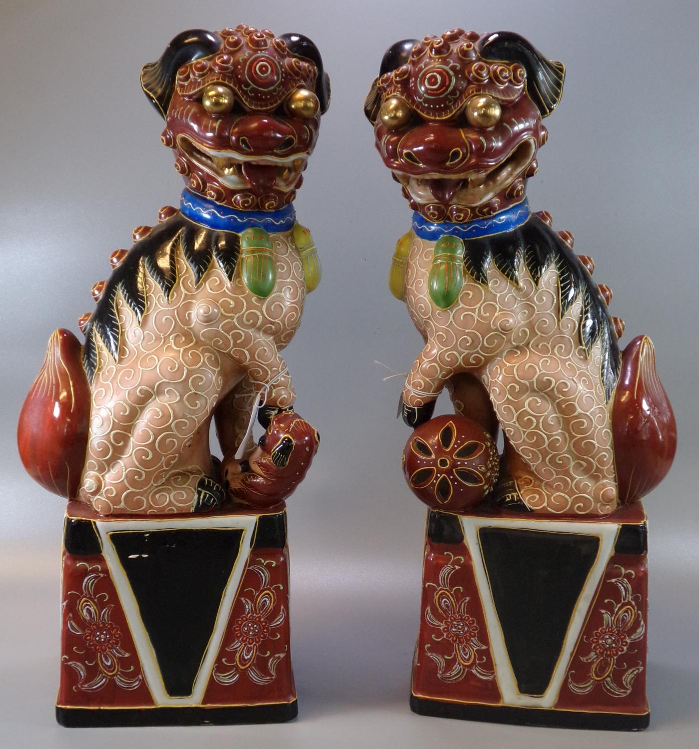 Pair of Chinese porcelain polychrome Temple lions or Fo Dogs. 45cm high approx. 20th century. (2) (