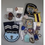 Plastic box of assorted National small bore Rifle Association medals, coins, all to ' P Dyche',